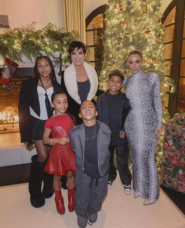 Kim Kardashian Stuns in Snakeskin Bodysuit While Celebrating Christmas Eve with Daughter Chicago