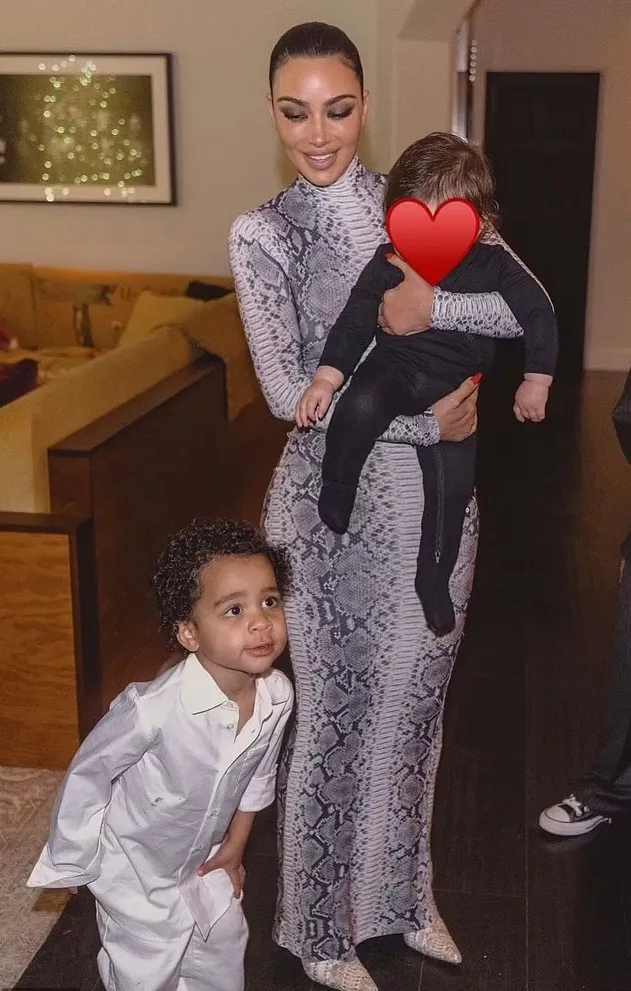 Kim Kardashian Stuns in Snakeskin Bodysuit While Celebrating Christmas Eve with Daughter Chicago