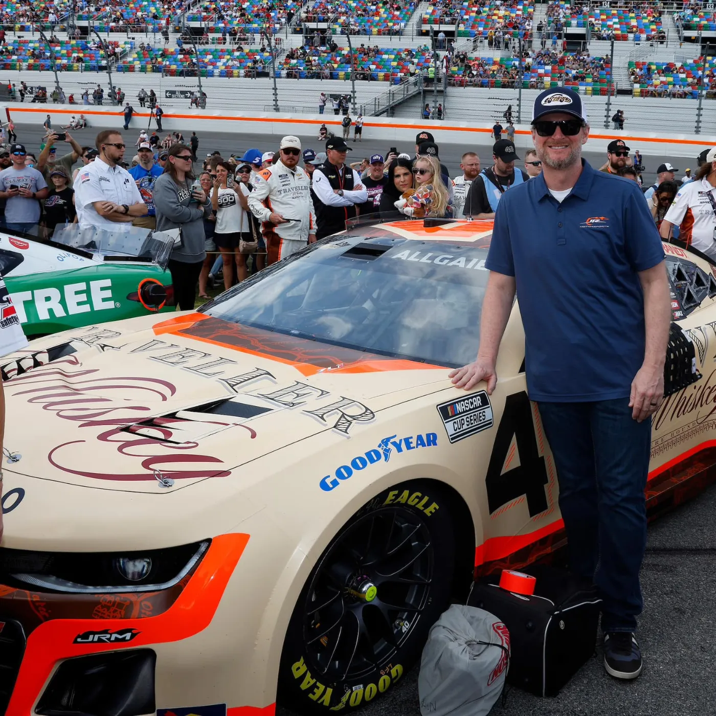 A family filled with love and racing spirit! Dale Earnhardt Jr., Amy, and their adorable daughters share a special moment at the track.