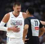 Nikola Jokić Hilariously Distracted by Family During Nuggets’ Game 5 Team Talk 1 Nikola Jokić Hilariously Distracted by Family During Nuggets’ Game 5 Team Talk