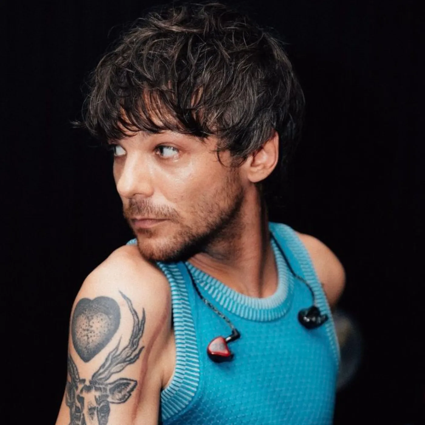 image_682a06df86662 Louis Tomlinson’s Viral Reaction to a Fan’s Tattoo Is Setting the Internet on Fire