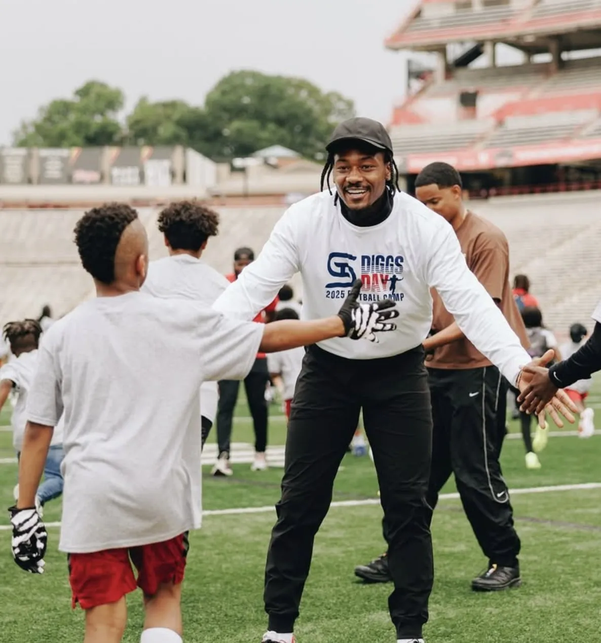 image_6848f7165ee87 Wait, Cardi B & NFL’s Stefon Diggs Were Caught On Camera Engaging In Heavy PDA at Youth Football Camp