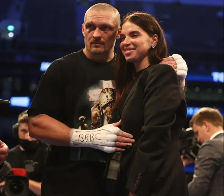 Who is the mysterious woman who makes the "beast" Usyk unusually gentle?