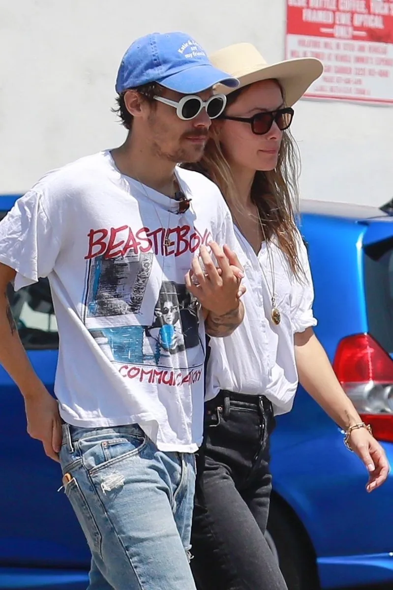 Olivia Wilde Struts Through Harry Styles’ Old Stomping Grounds With Mystery Man — Coincidence or a Calculated Clapback?