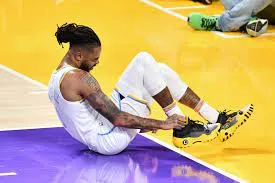 A Costly Mistake: How One Misstep Led to D'Angelo Russell's Painful Injury During the Game