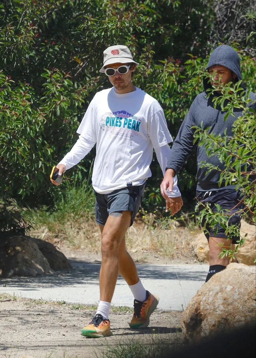 What Is Harry Styles Doing in This Tiny Irish Town — And Who’s the Mystery Man by His Side?