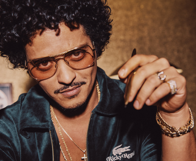 How much debt did the "APT" fever help Bruno Mars pay off?