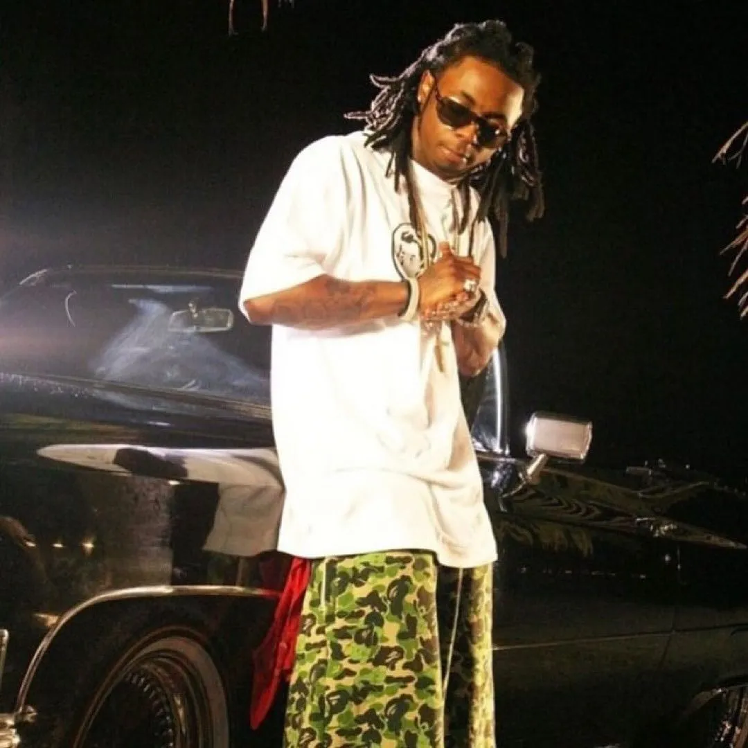 Lil Wayne Dominates BAPE Fashion in 2005 — But Fans Are Shocked When He Ditches ‘Hustler Muzik’ for a Baby Milo Monogram Tee!