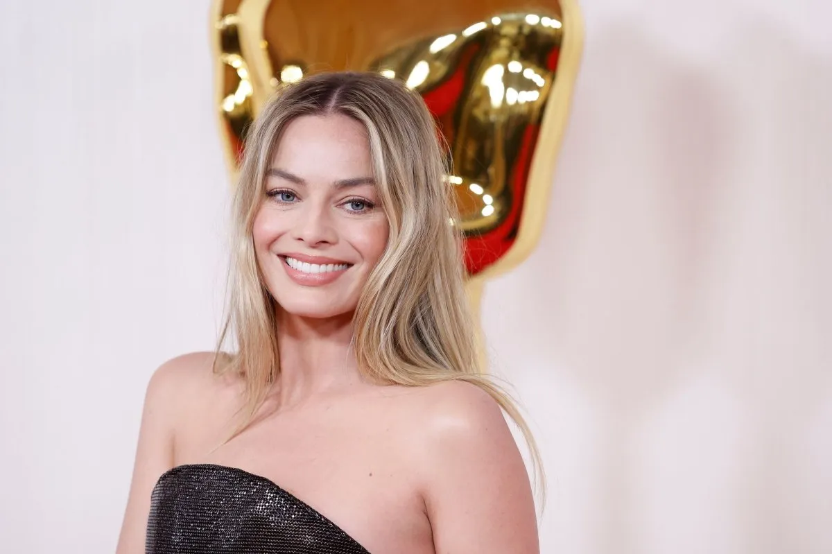 image_68c0d7c429def Margot Robbie walks through a door... and into someone else's past?! Are you into this magical realism?