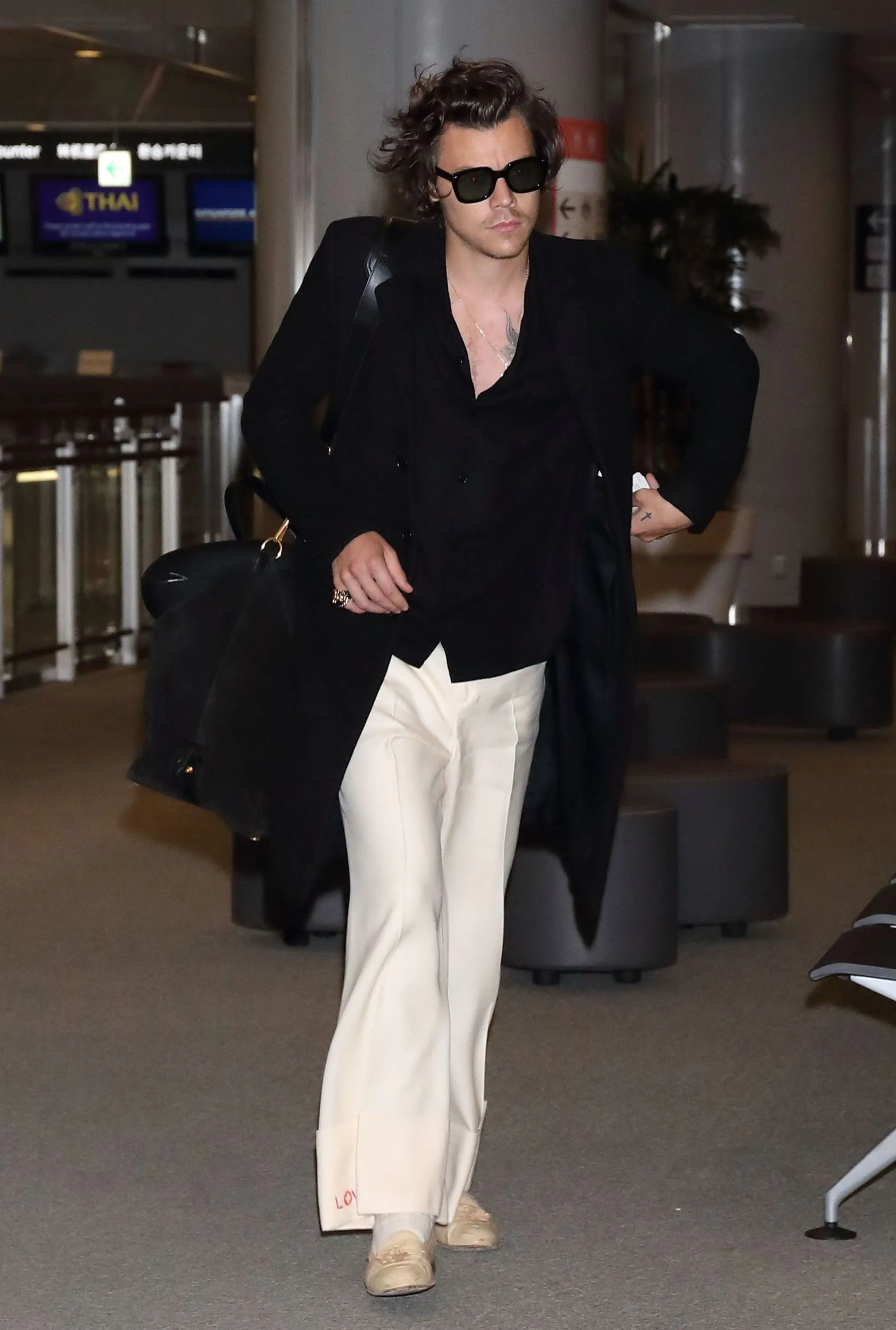 image_68ca14e0b2dcd Harry Styles Just Transformed the Airport Into a Fashion Spectacle — His Style Evolution Will Leave You Speechless